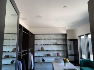 luxury home walk in closet with professionally installed security and lighting